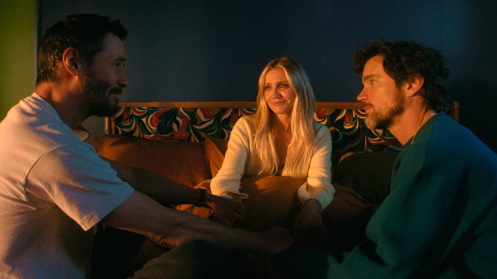 reef clasping hands with kyle and xander as they sit together in outcome