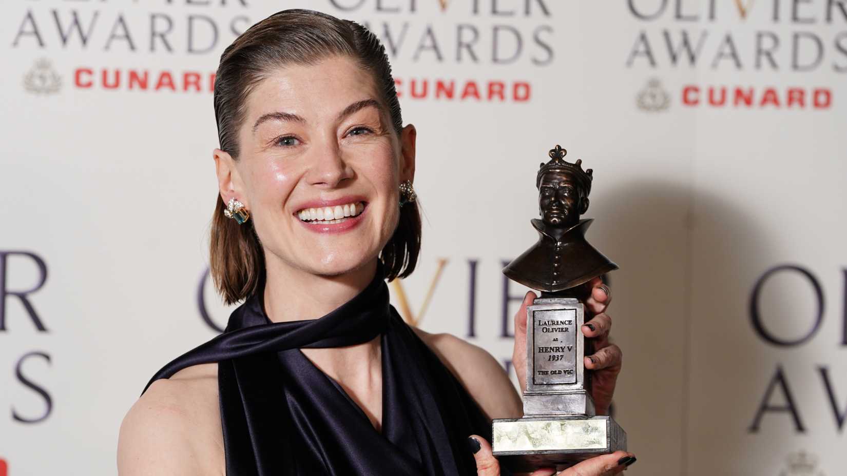 rosamund pike with her best actress award for inter alia at the olivier awards at the royal albert hall