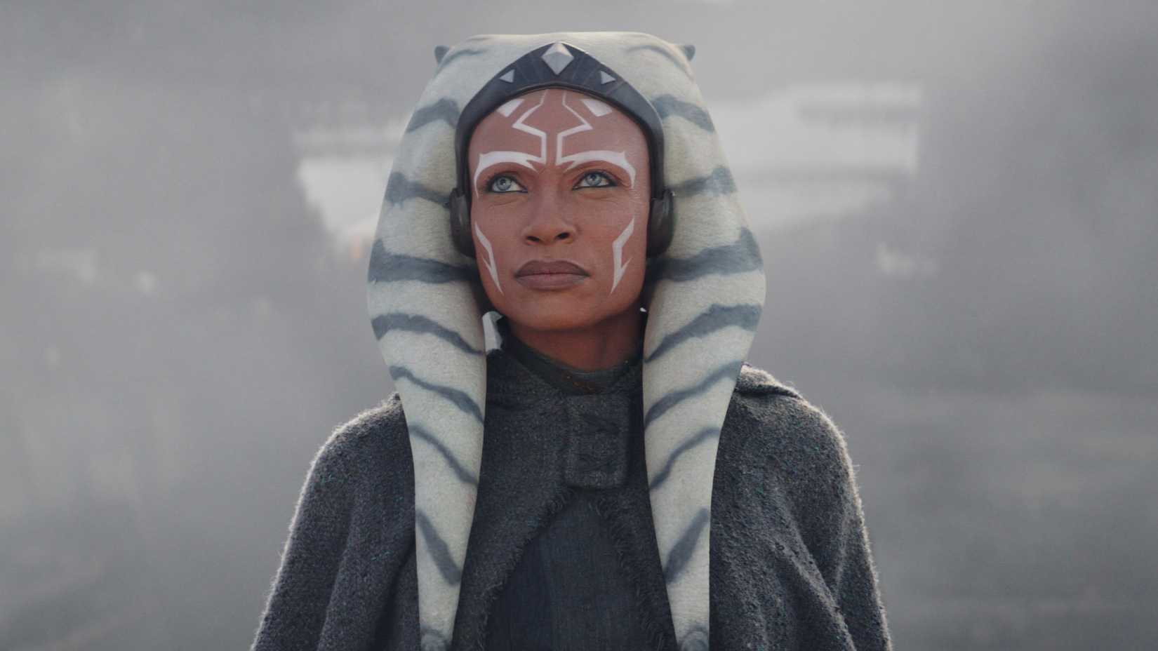 Rosario Dawson as Ahsoka Tano looking up at the sky in Ahsoka