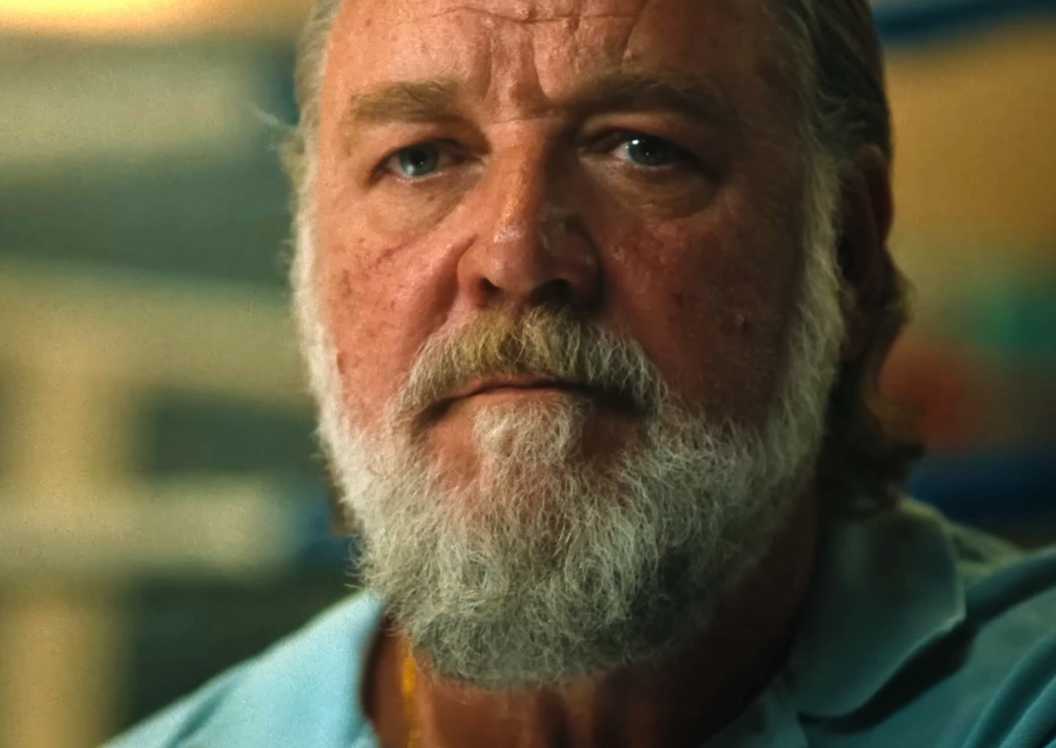 Russell Crowe is watching someone in Beast