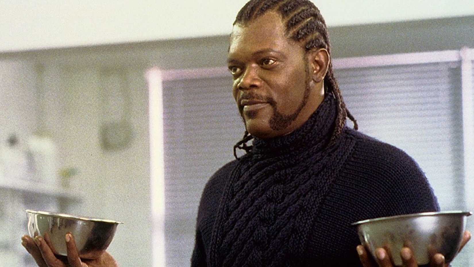 samuel l jackson as milo holding up two metal bowls in formula 51