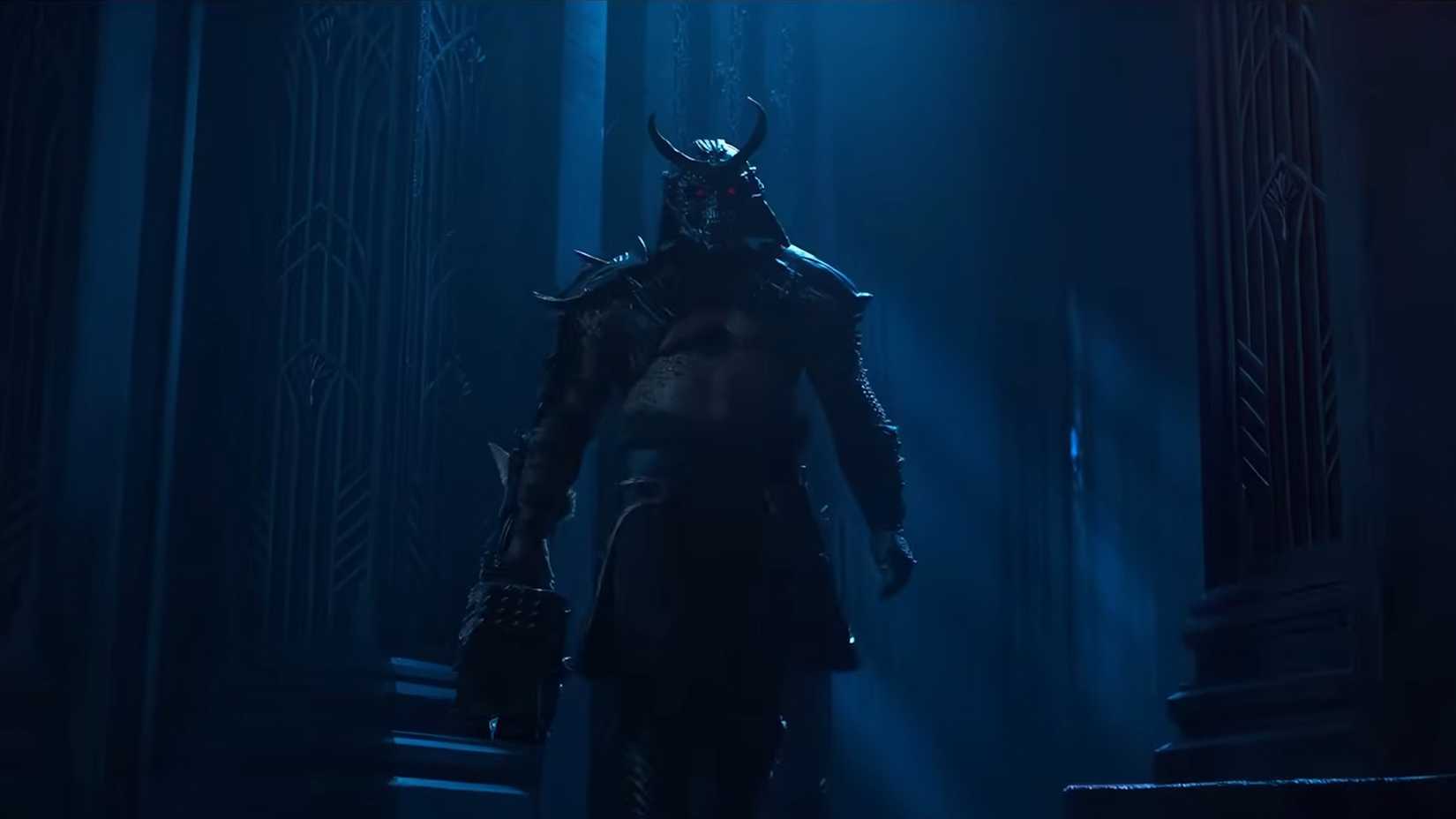 shao khan looking menacing holding a hammer in mortal kombat 2 trailer