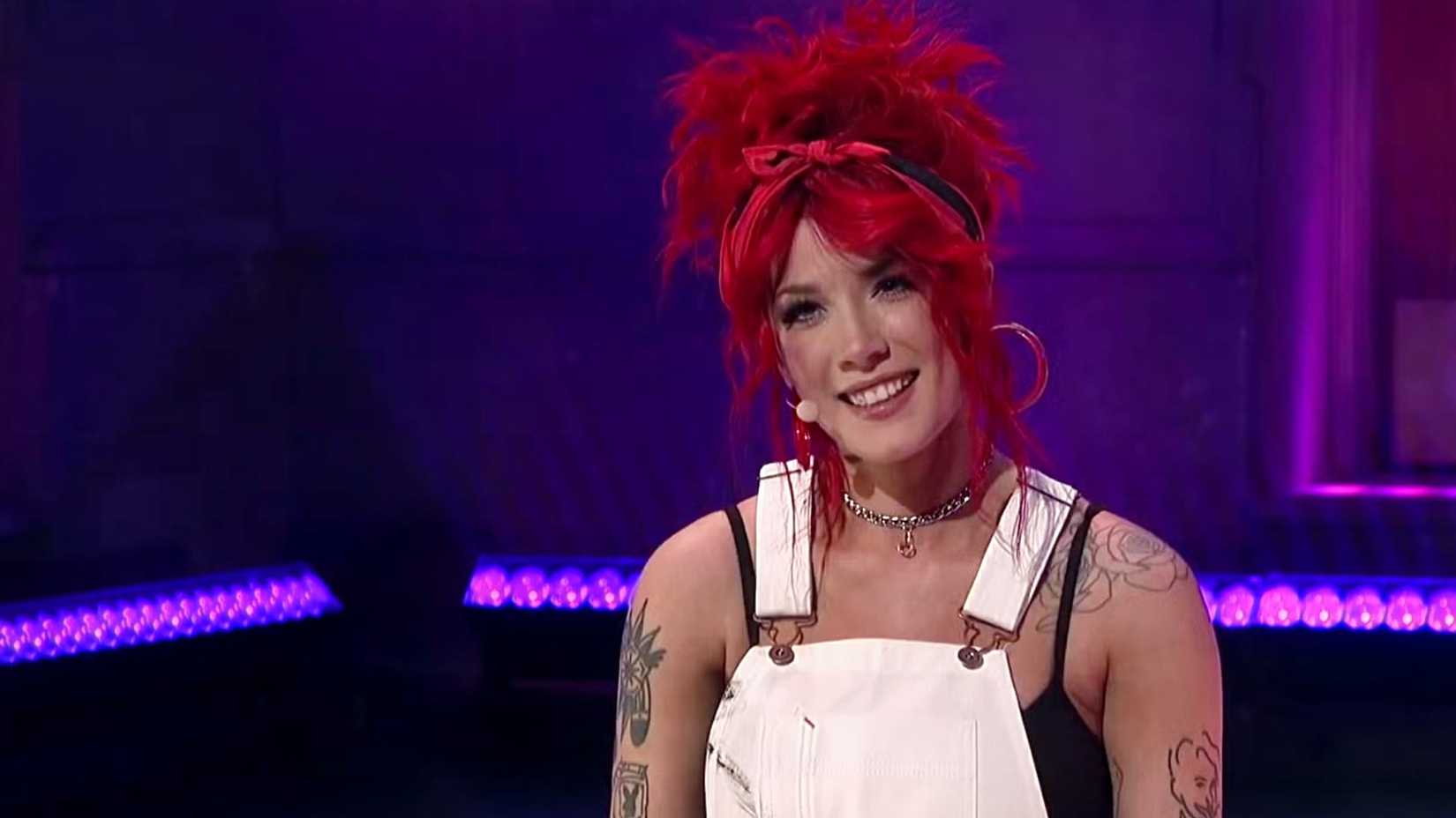 Halsey smiles with red hair on SNL 2019