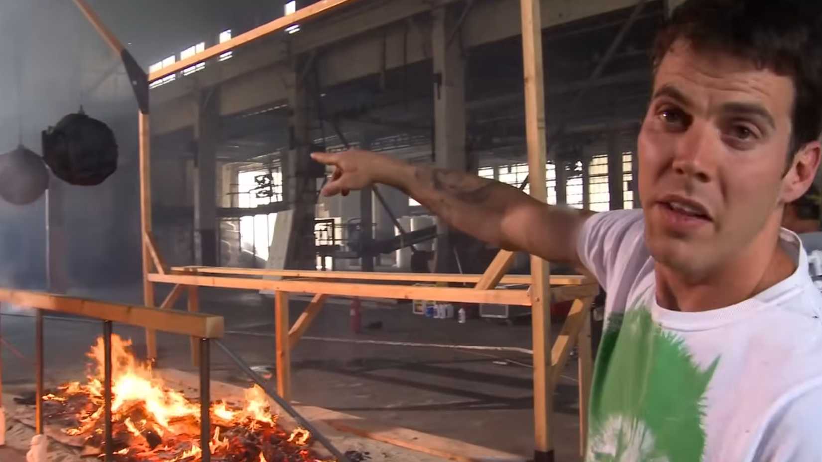 Steve O pointing at the Flaming Gauntlet in Jackass 3 point 5