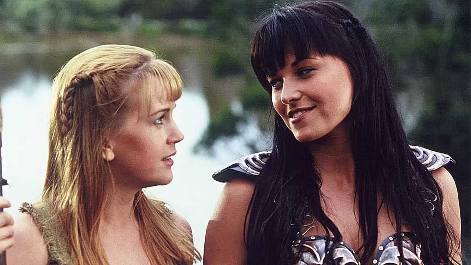 Still from Xena the Warrior Princess, Xena (Lucy Lawless) and Gabrielle (Renee O'Connor) share a sweet, longing look
