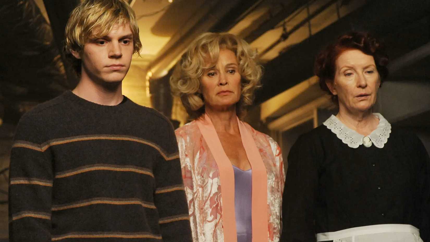 Tate, Constance, and Moira looking worried in American Horror Story