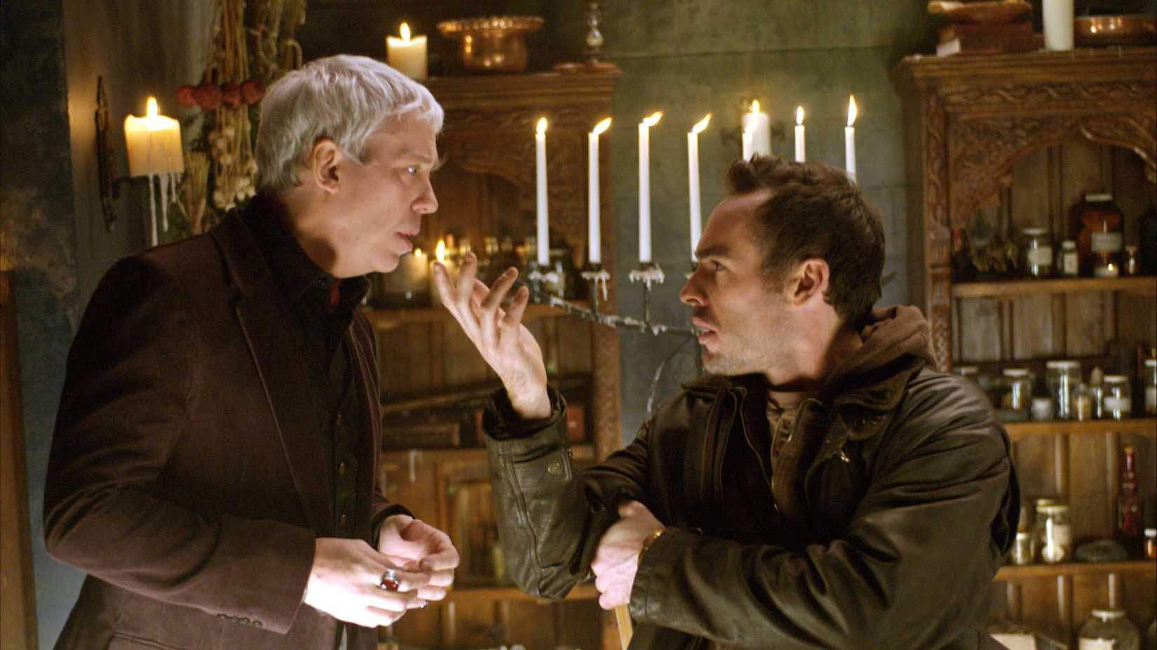 Harry Dresden doing magic while Bob looks shocked in The Dresden Files