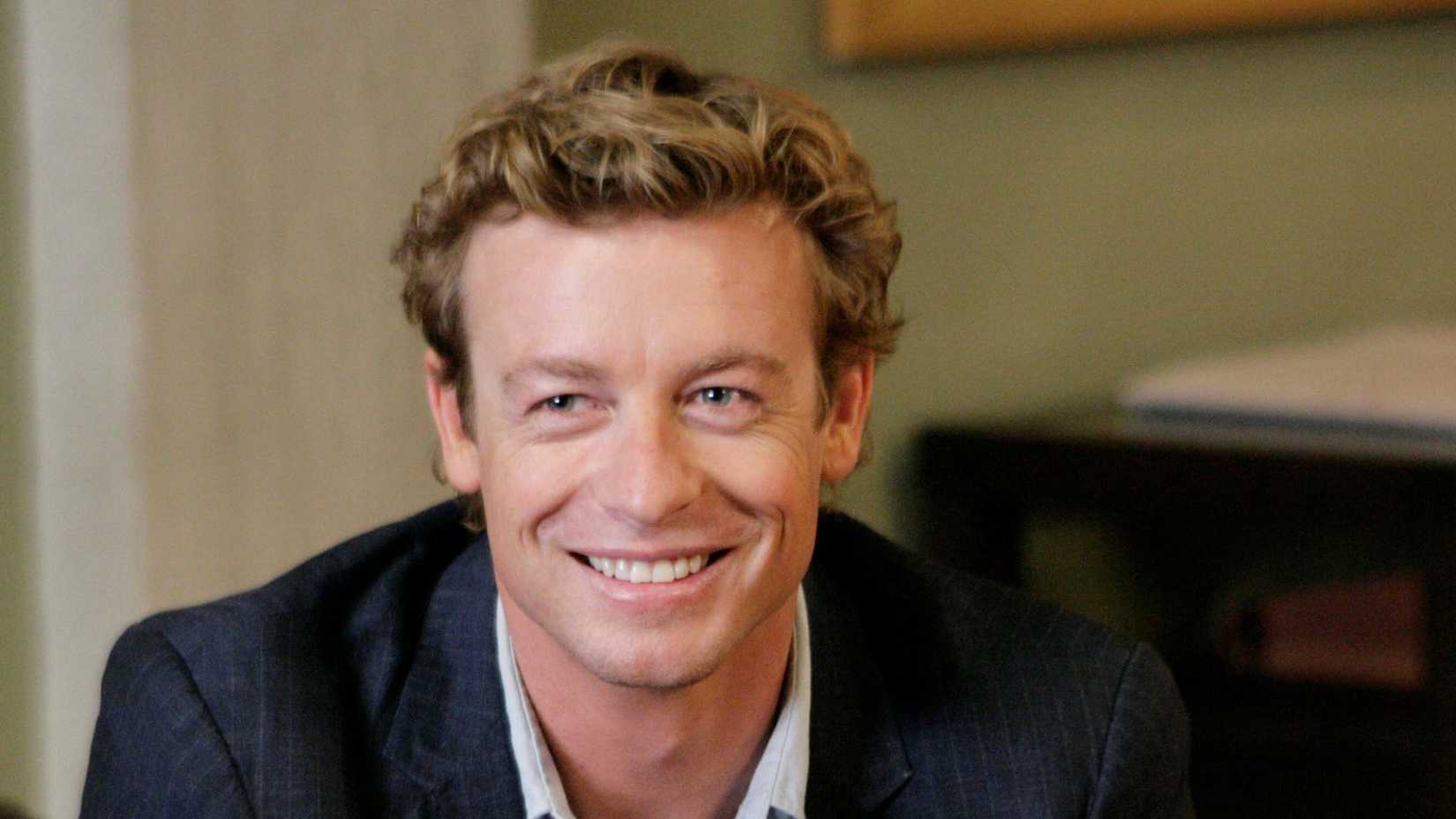 Patrick Jane (Simon Baker) smiling in The Mentalist.