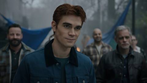 KJ Apa smiling slightly in Riverdale