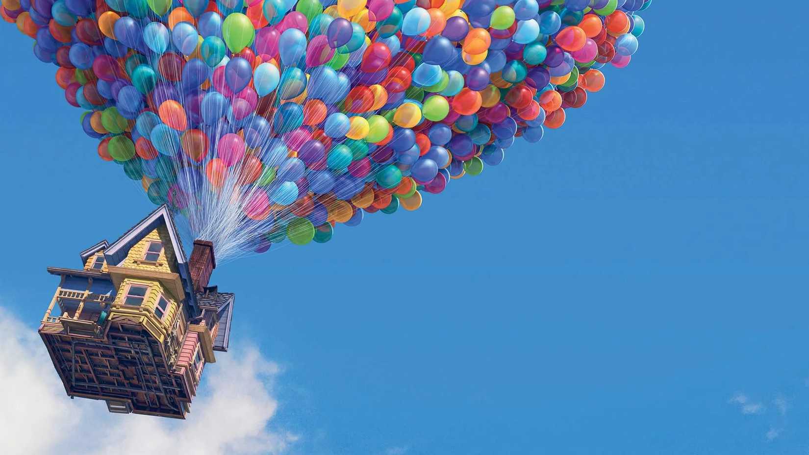 the house from up flies in a blue sky