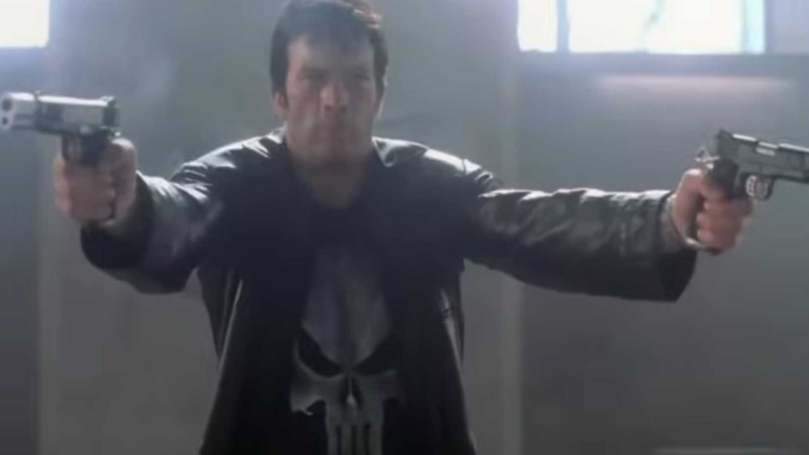 The punisher wearing a trench coat holding two pistols in the 2004 movie