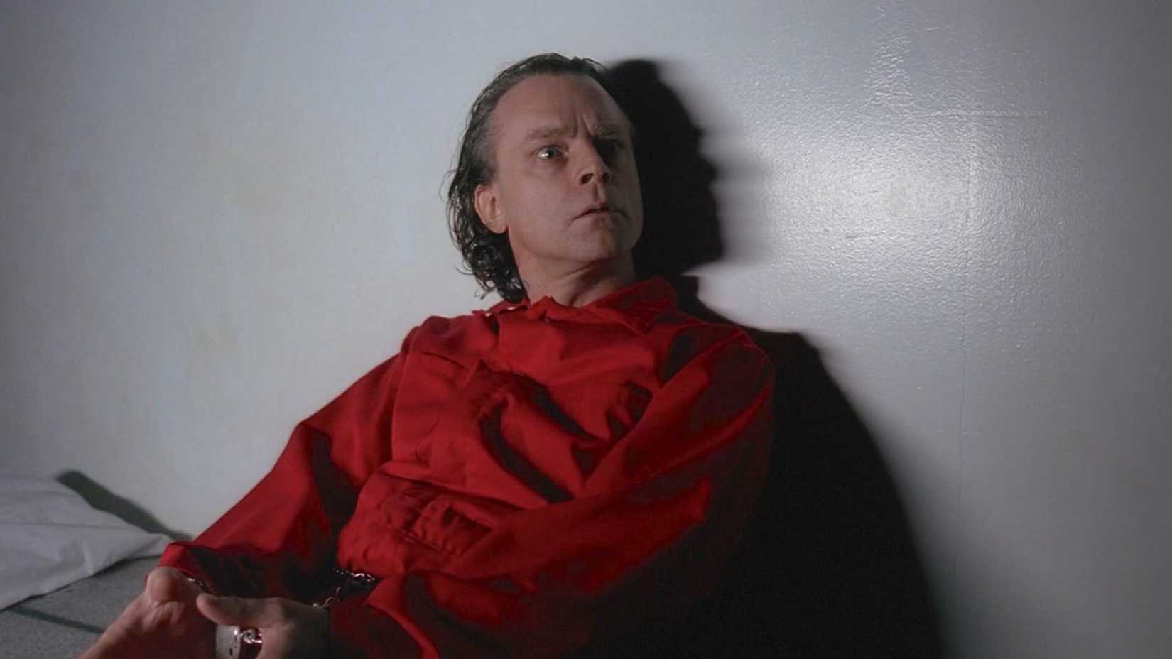 10 Best Episodes From The X-Files Season 1, Ranked 7 Brad Dourif sits against a wall on The X-Files