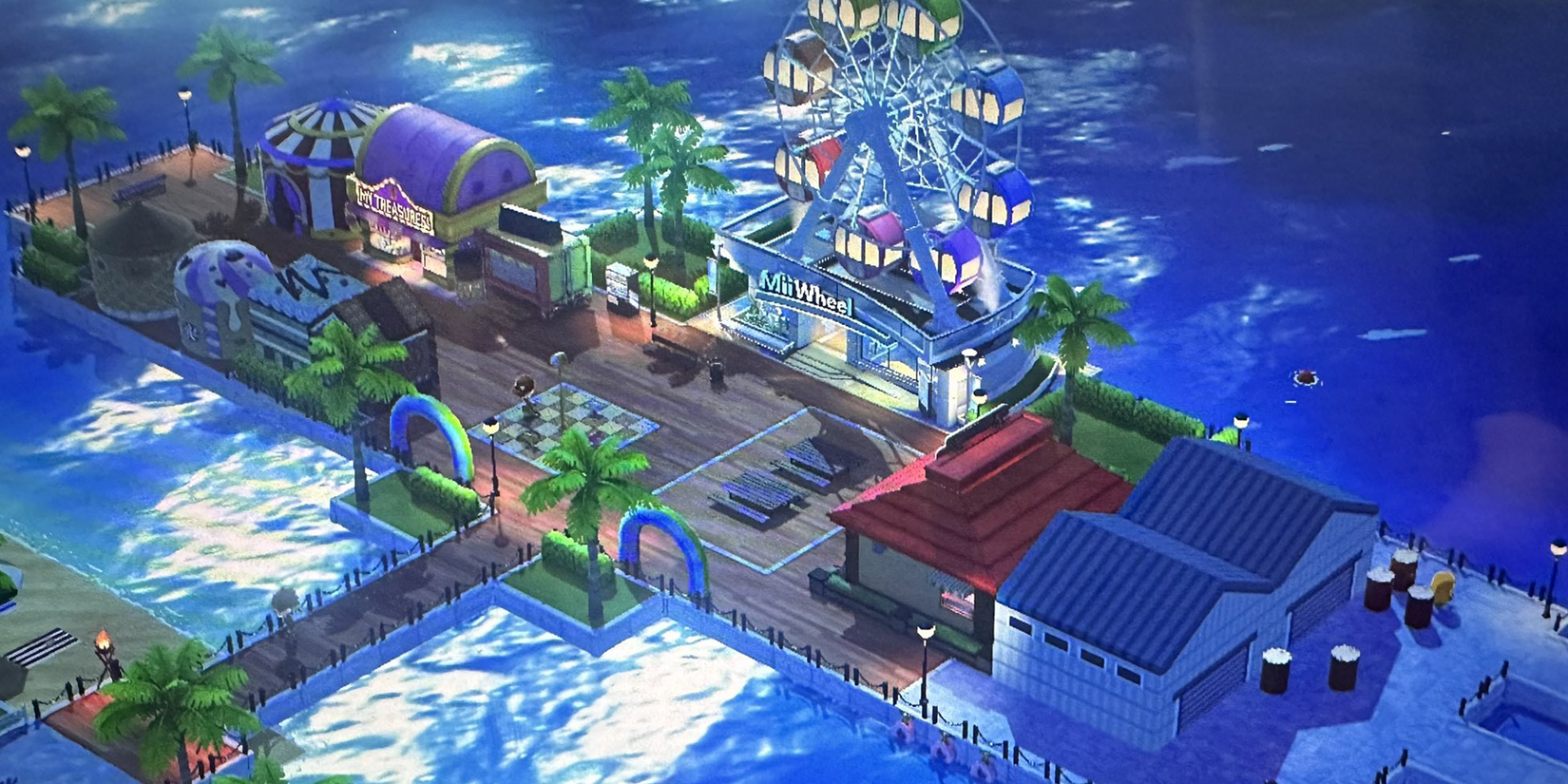 Tomodaochi Life pier with amusement park stands