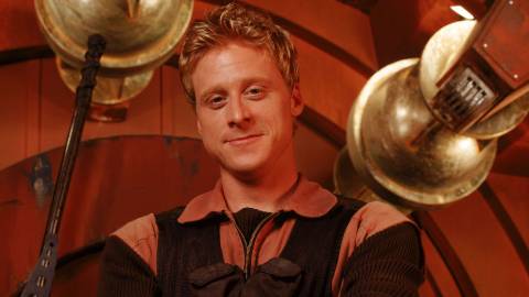 A close-up of a smiling Wash in Firefly