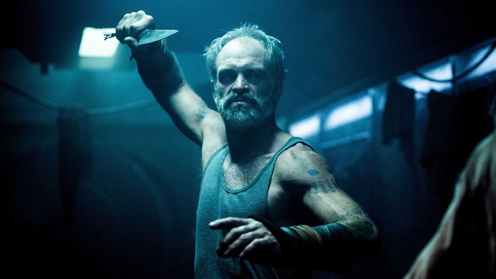 Steven Ogg fighting with a knife in Snowpiercer