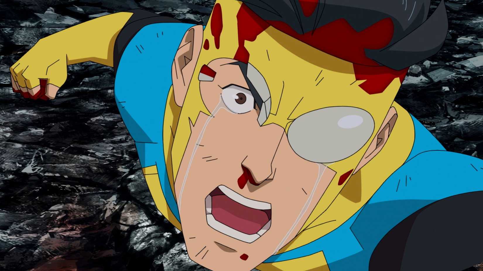 Invincible, battered and with blood on his face