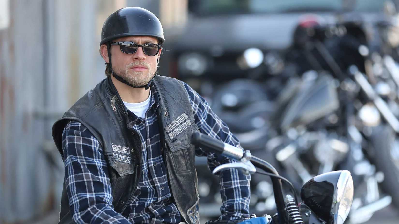 Jax on his bike wearing a helmet and sunglasses