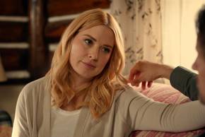 Mel sits on the couch and looks at Jack in Virgin River season 7 episode 1