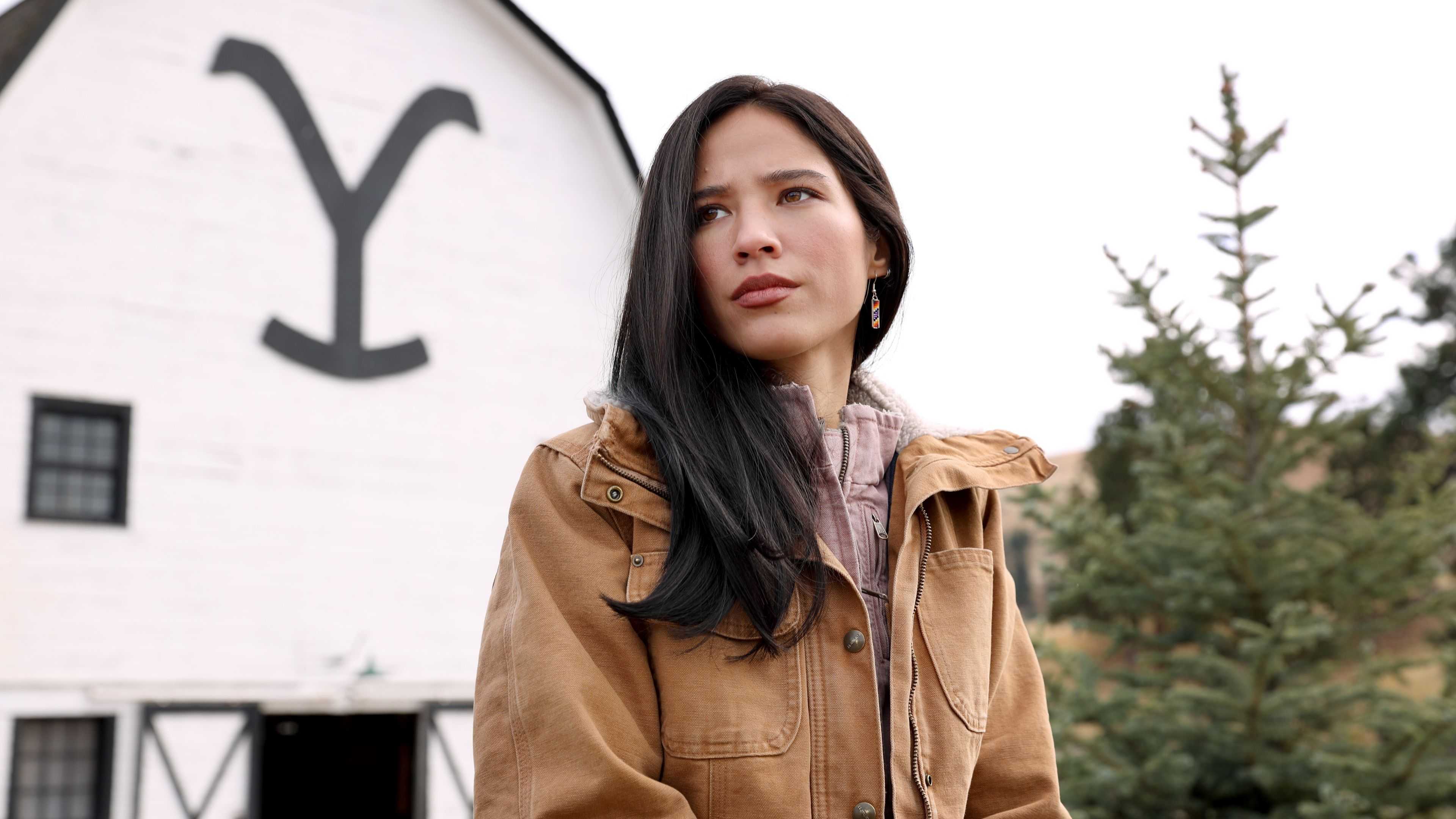 Kelsey Asbille as Monica Dutton looking concerned in Yellowstone.