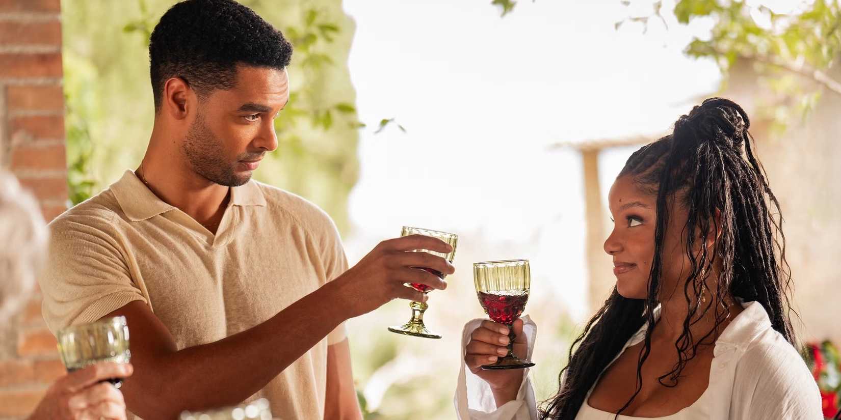 You, Me & Tuscany Michael and Anna clink wine glasses