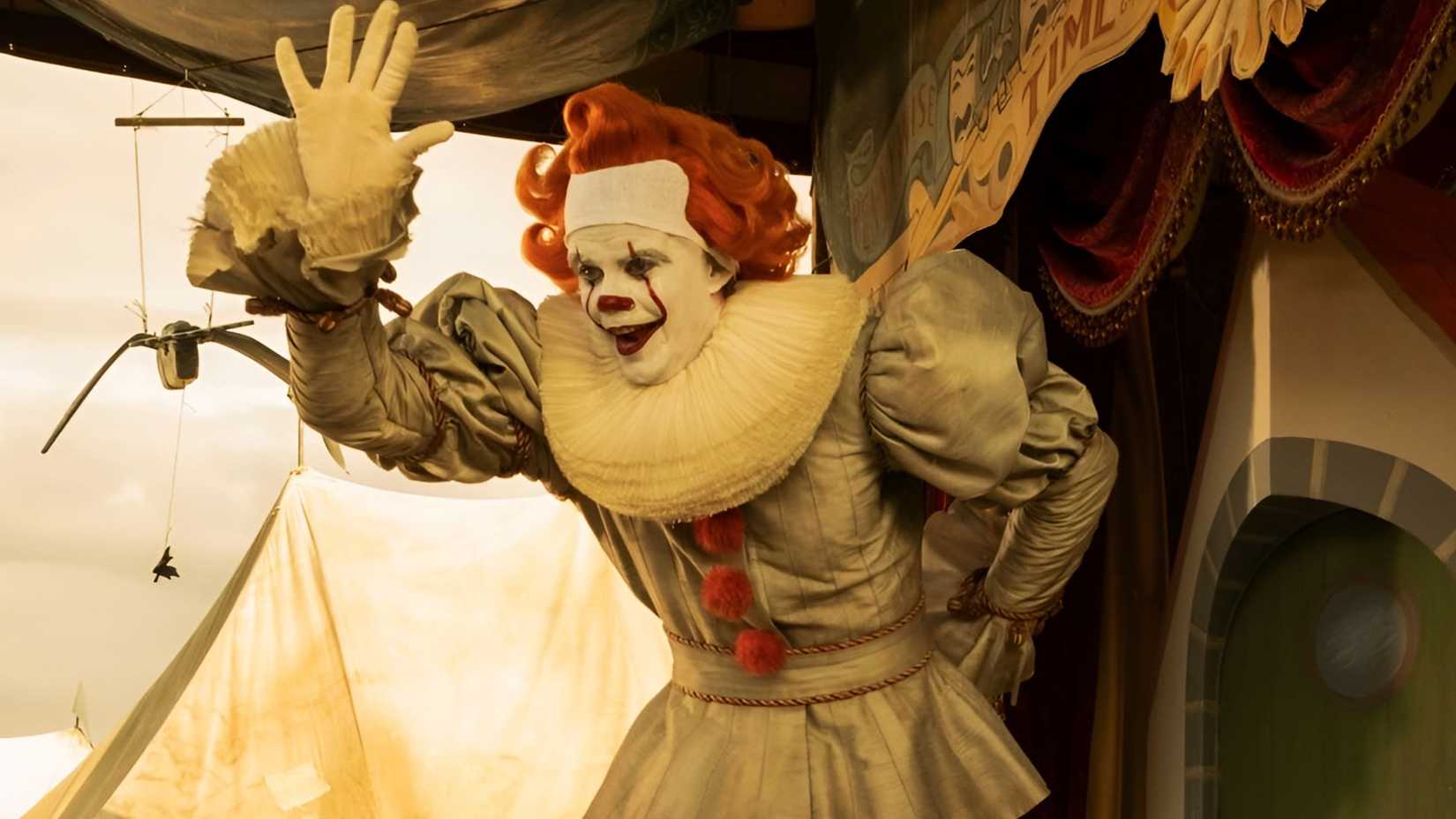 Bill Skarsgård as a clown, waving at children in a flashback in It: Welcome to Derry season 1