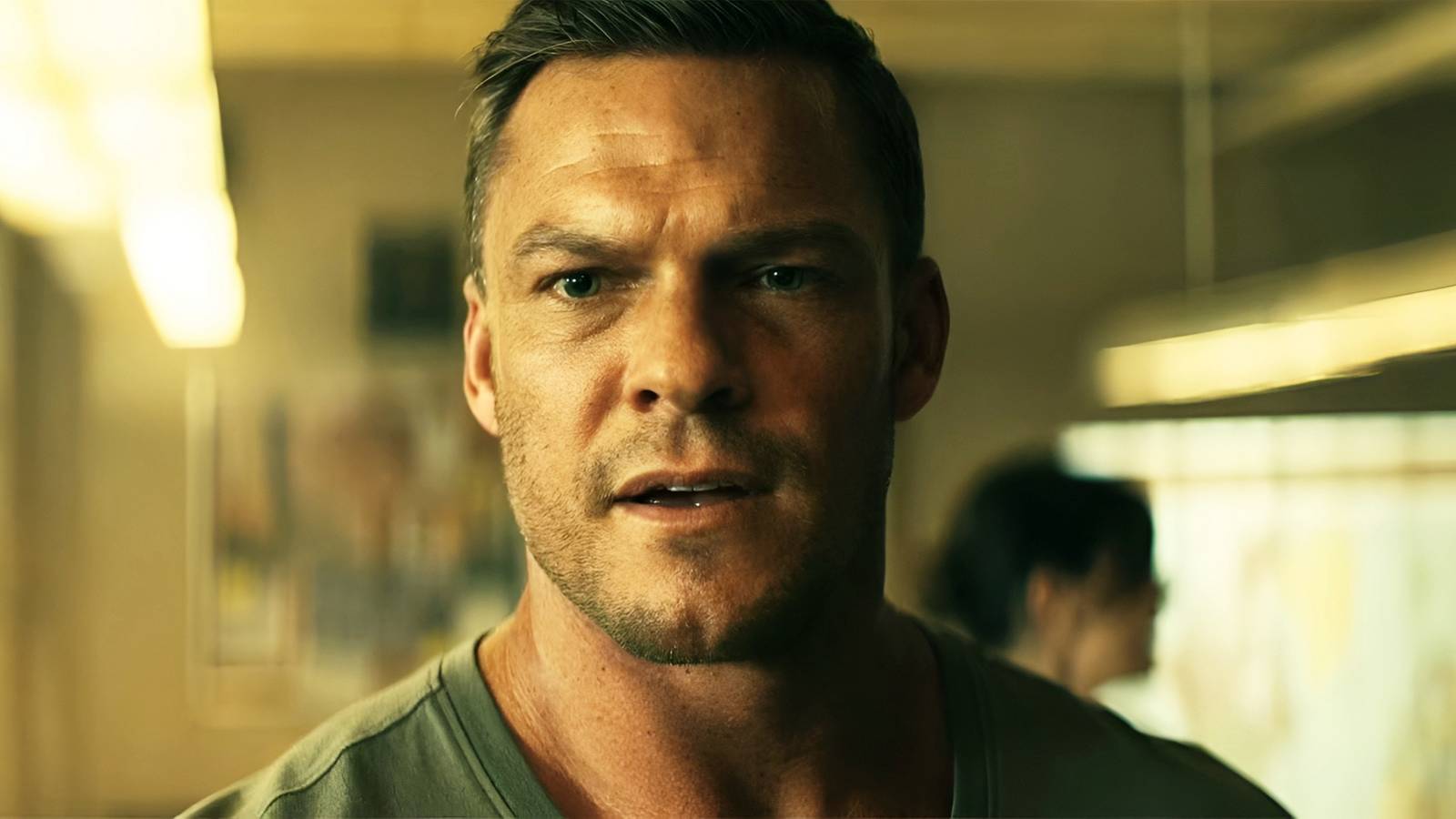 Alan Ritchson’s Jack Reacher looking surprised in Prime Video’s Reacher