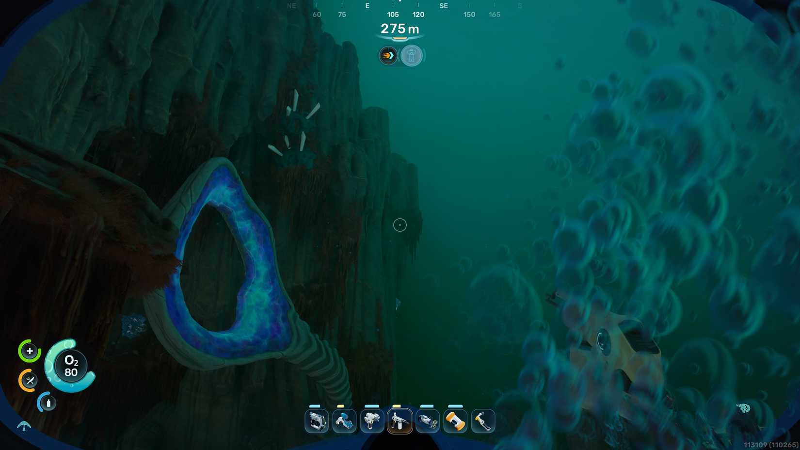 A player expressing bubbles swims towards two Enamel Husks in a rock wall above a geode-like structure in Subnautica 2