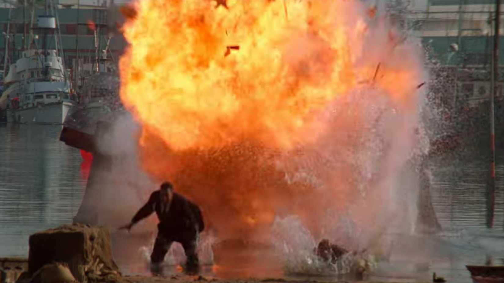 A speedboat bursts into flames as Nic Cage and John Travolta fight in Face Off