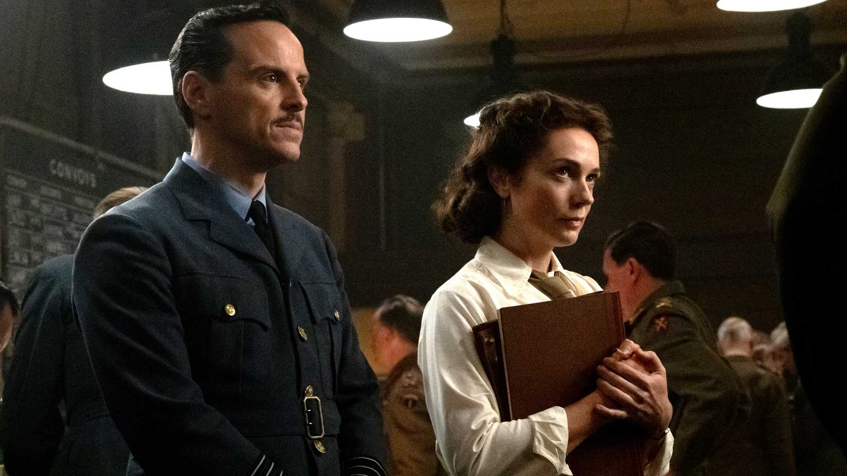 Andrew Scott's Stagg and Kerry Condon's Summersby looking in thought at someone in Pressure