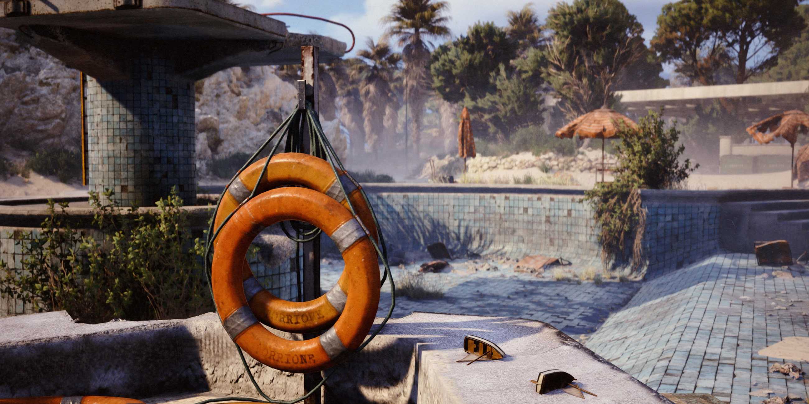 Life preservers on a hook near an empty, abandoned pool in ARC Raiders' Riven Tides map.