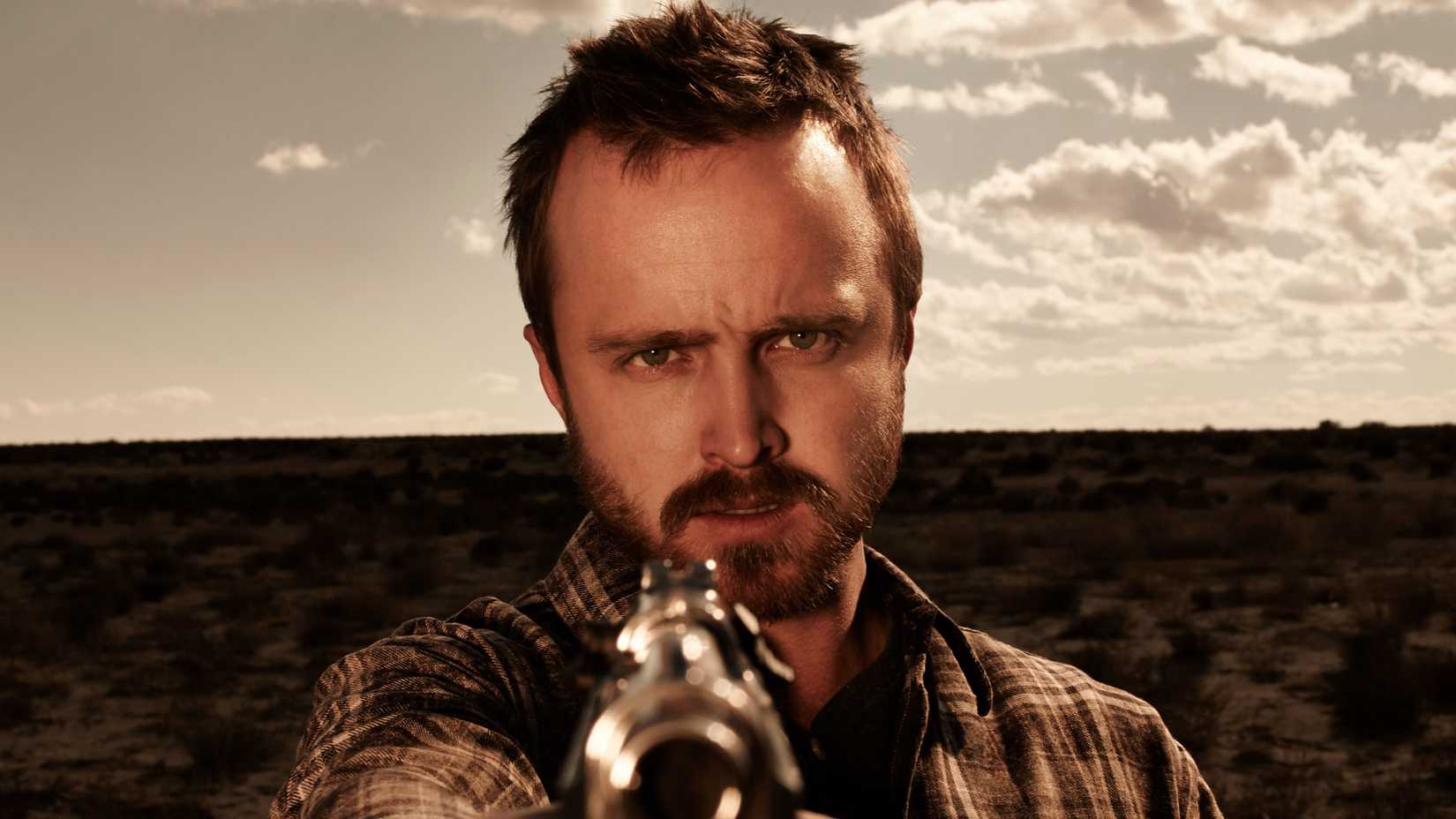 Aaron Paul’s Jesse Pinkman pointing a gun in Breaking Bad