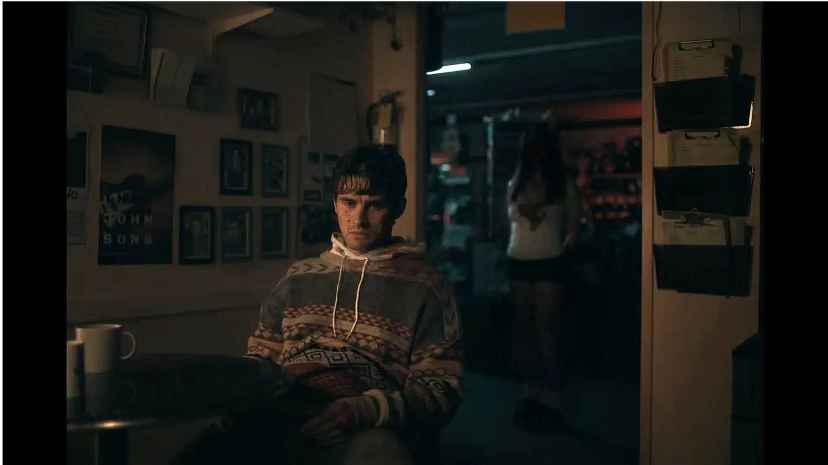 Bear sitting in silence as Nikki stands behind him in Obsession