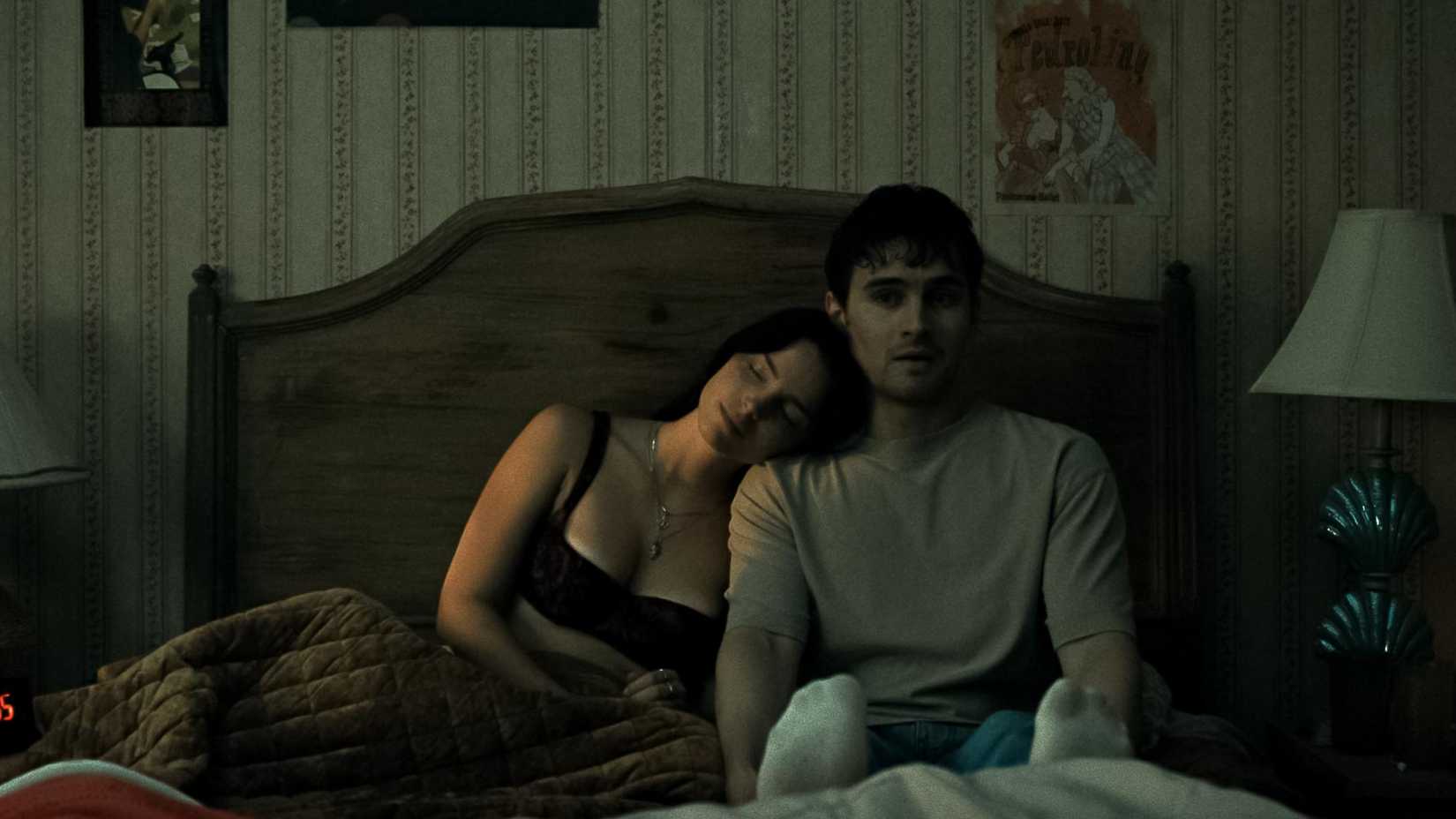 Bear and Nikki in bed together, Nikki's head resting on his shoulder, in Obsession