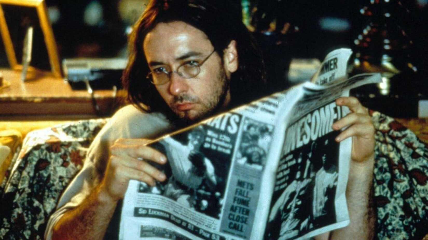 John Cusack reads a paper in Being John Malkovich