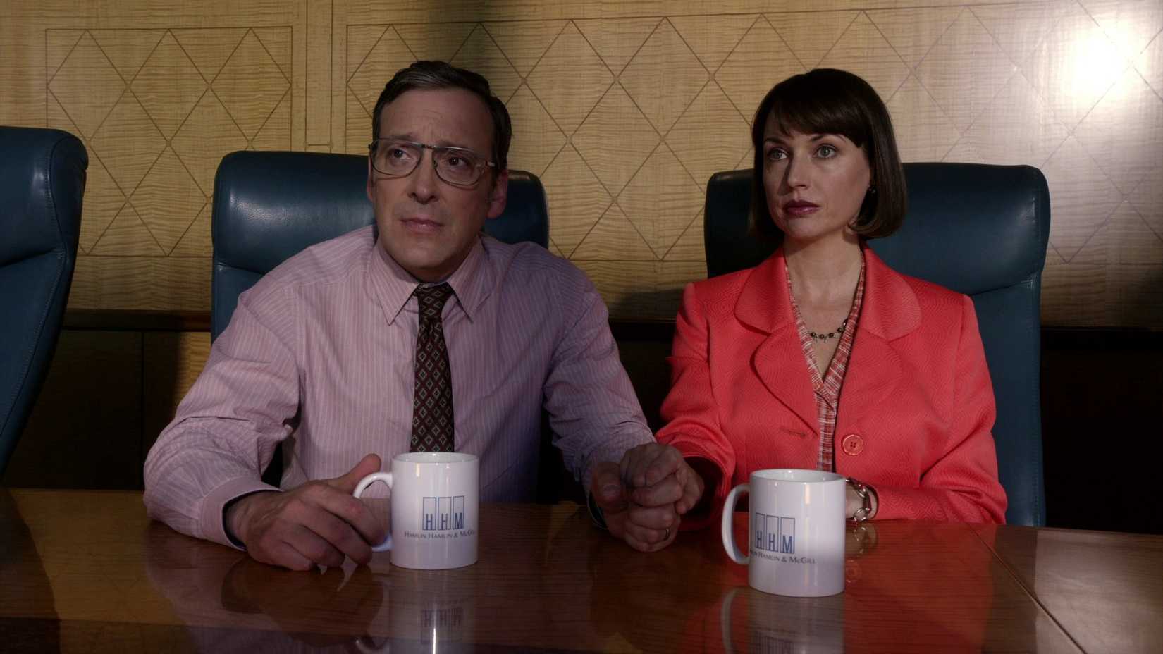 betsy and craig kettleman sitting at a desk with mugs in better call saul season 1 episode 7