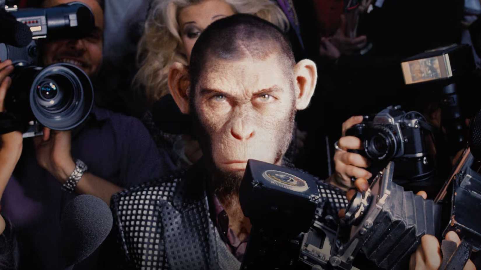better man movie poster showing robbie williams as a chimp