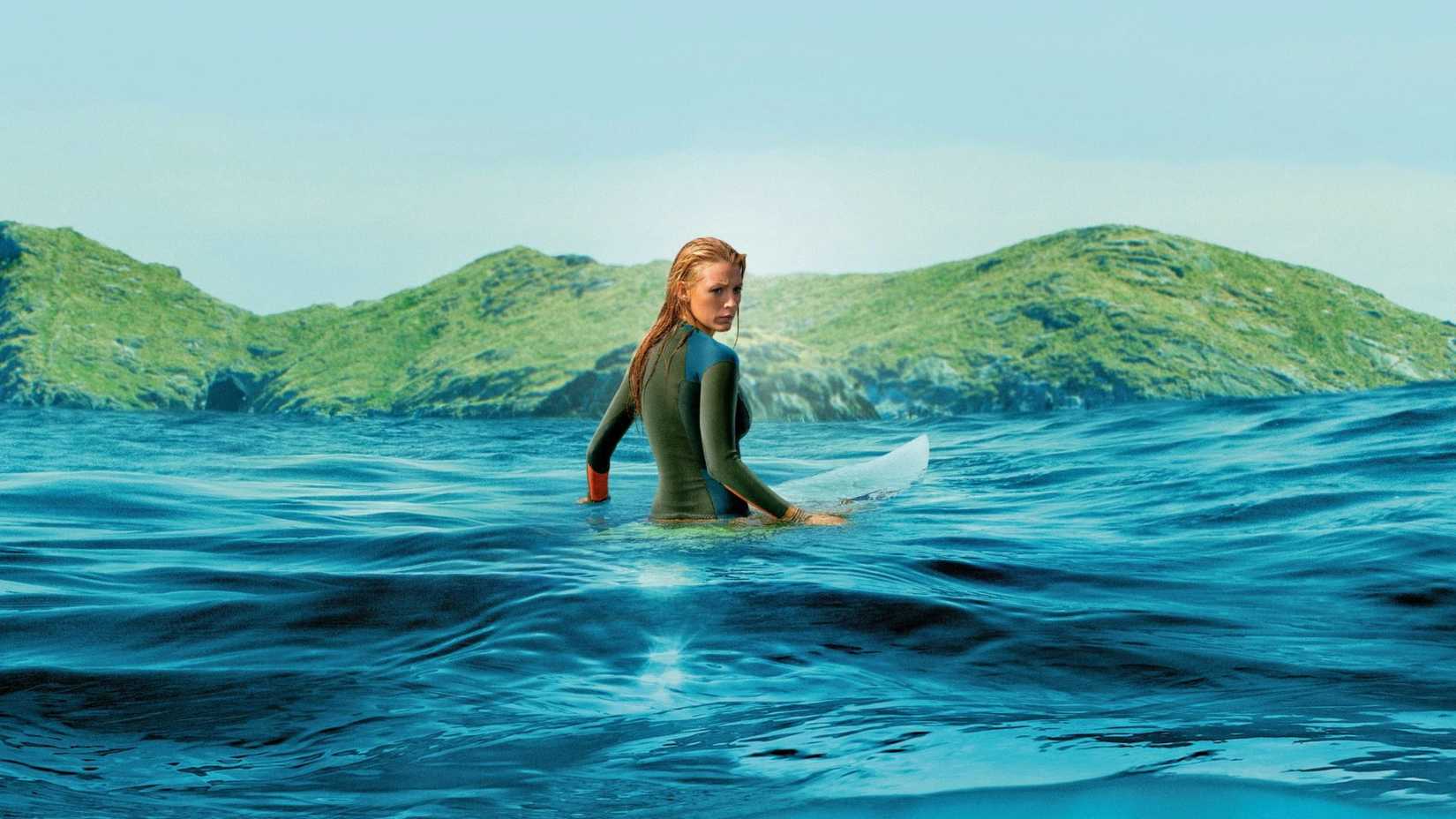 blake lively as nancy adams on her surfboard in the shallows