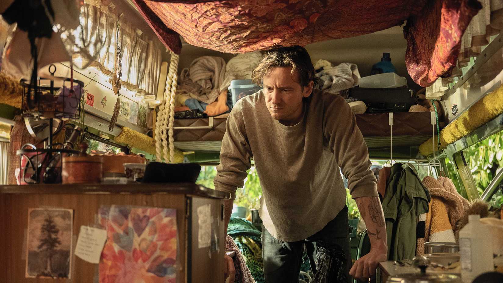 cameron looks upset while in his camper van in netflix s remarkably bright creatures