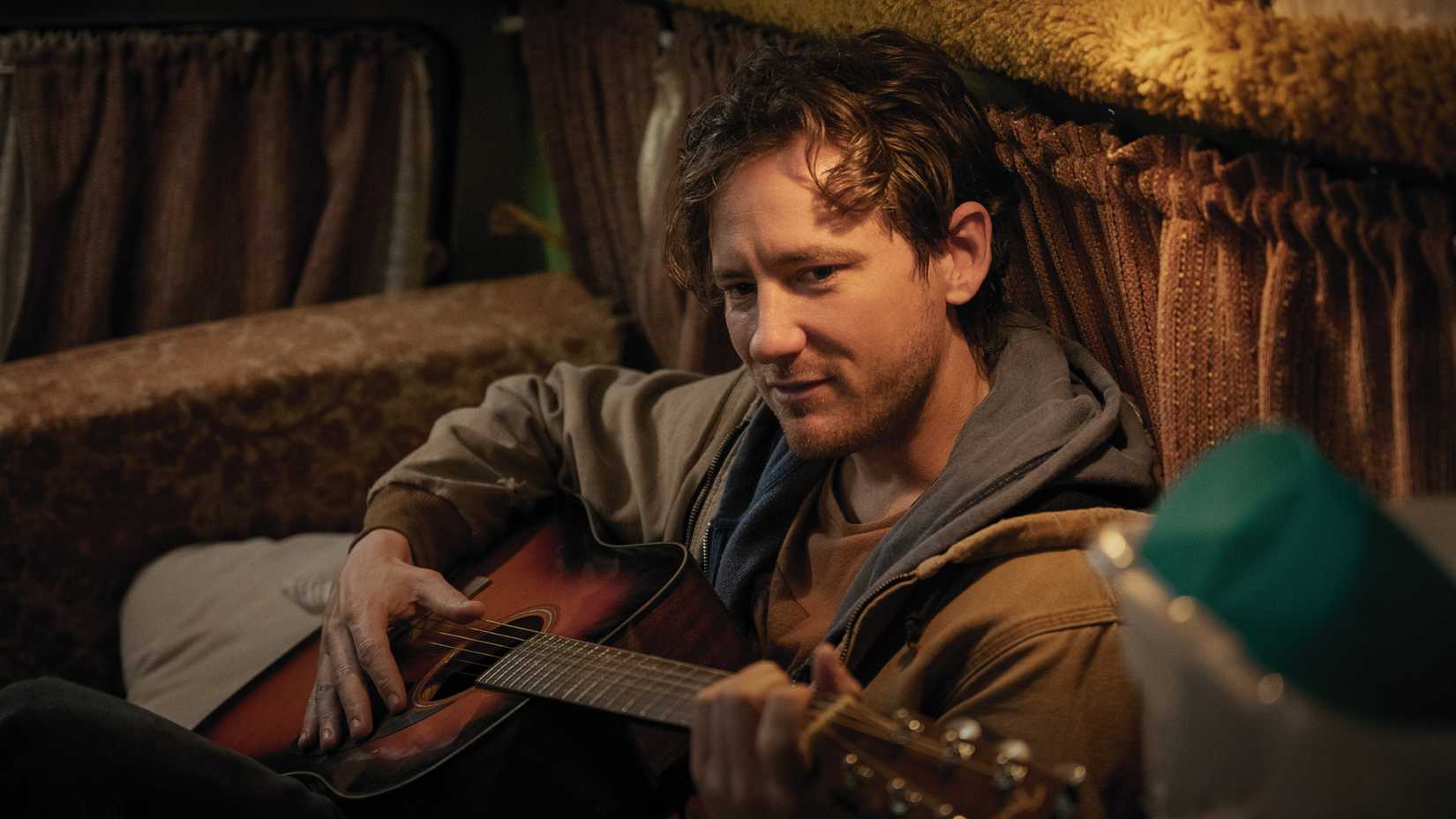 cameron plays his guitar in remarkably bright creatures