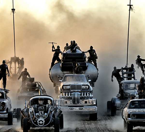 Cars kicking up a dust cloud in Mad Max: Fury Road.