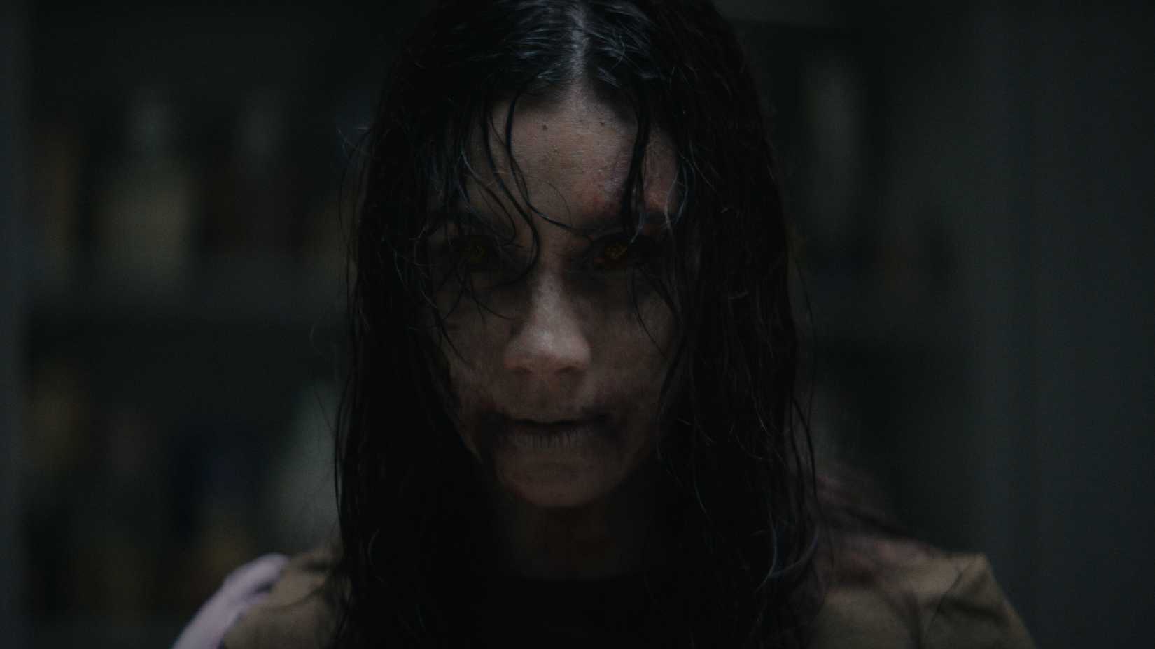close up of a deadite s face in evil dead burn 1