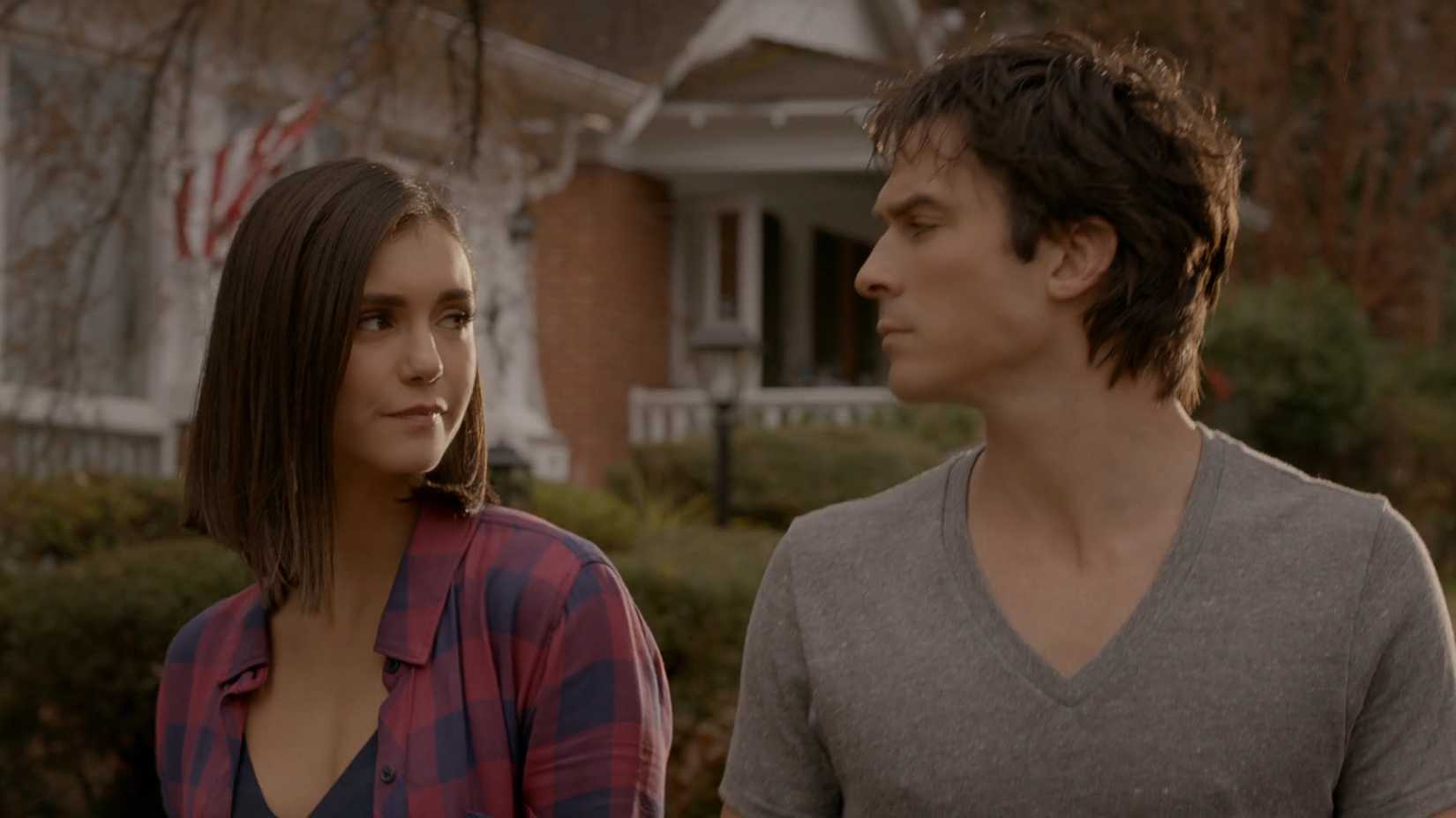 Damon and Elena smile at each other in the finale of The Vampire Diaries season 8