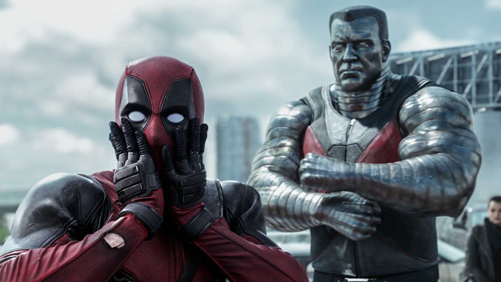 Deadpool looks shocked while Colossus stands behind him angrily in the first Deadpool movie