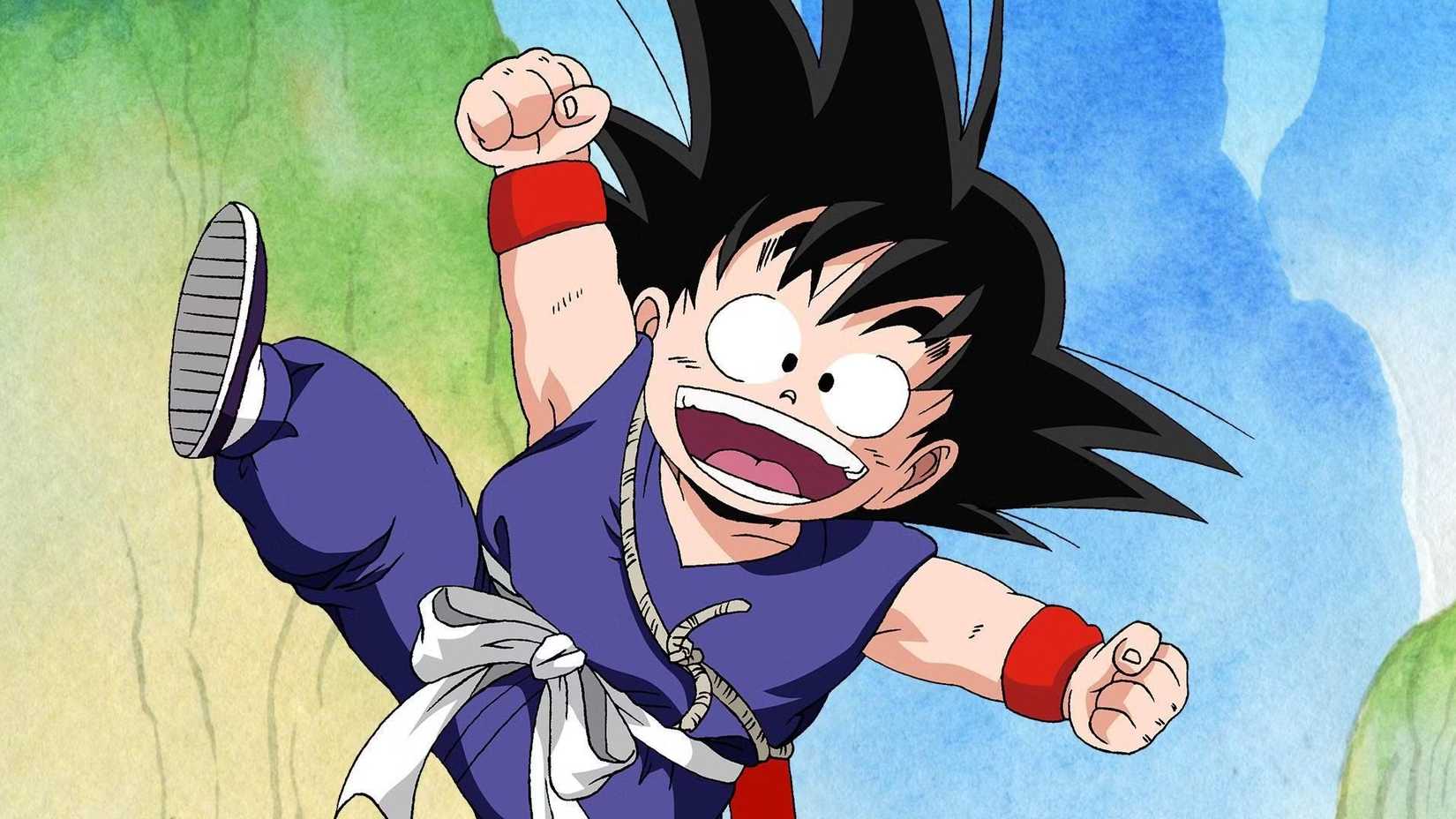 Young Goku jumping into the air with an excited expression