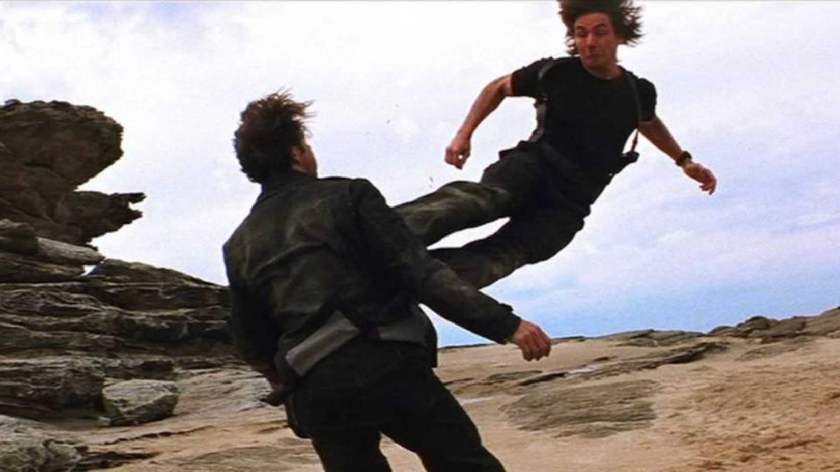 Ethan Hunt beats Sean Ambrose with a flying kick in Mission Impossible 2