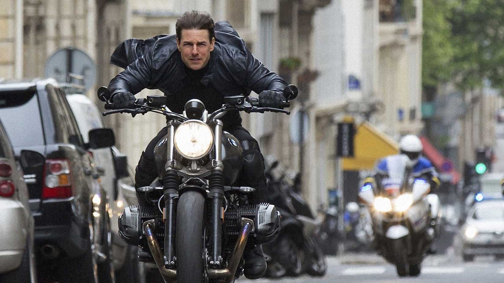 Ethan Hunt (Tom Cruise) fleeing the police on a motorbike in mission impossible fallout
