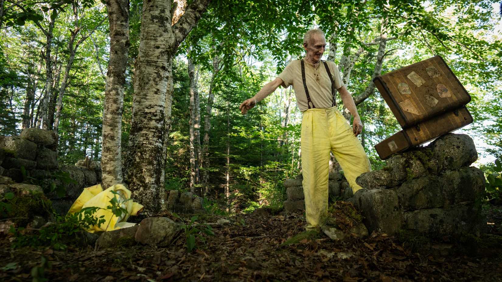 The Man in Yellow Taking Off His Suit in From