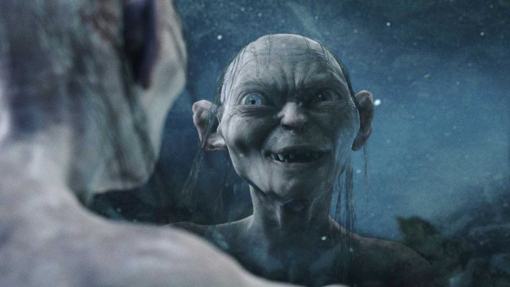 Gollum smiling at Smeagol through his reflection in The Lord of the Rings The Return of the King
