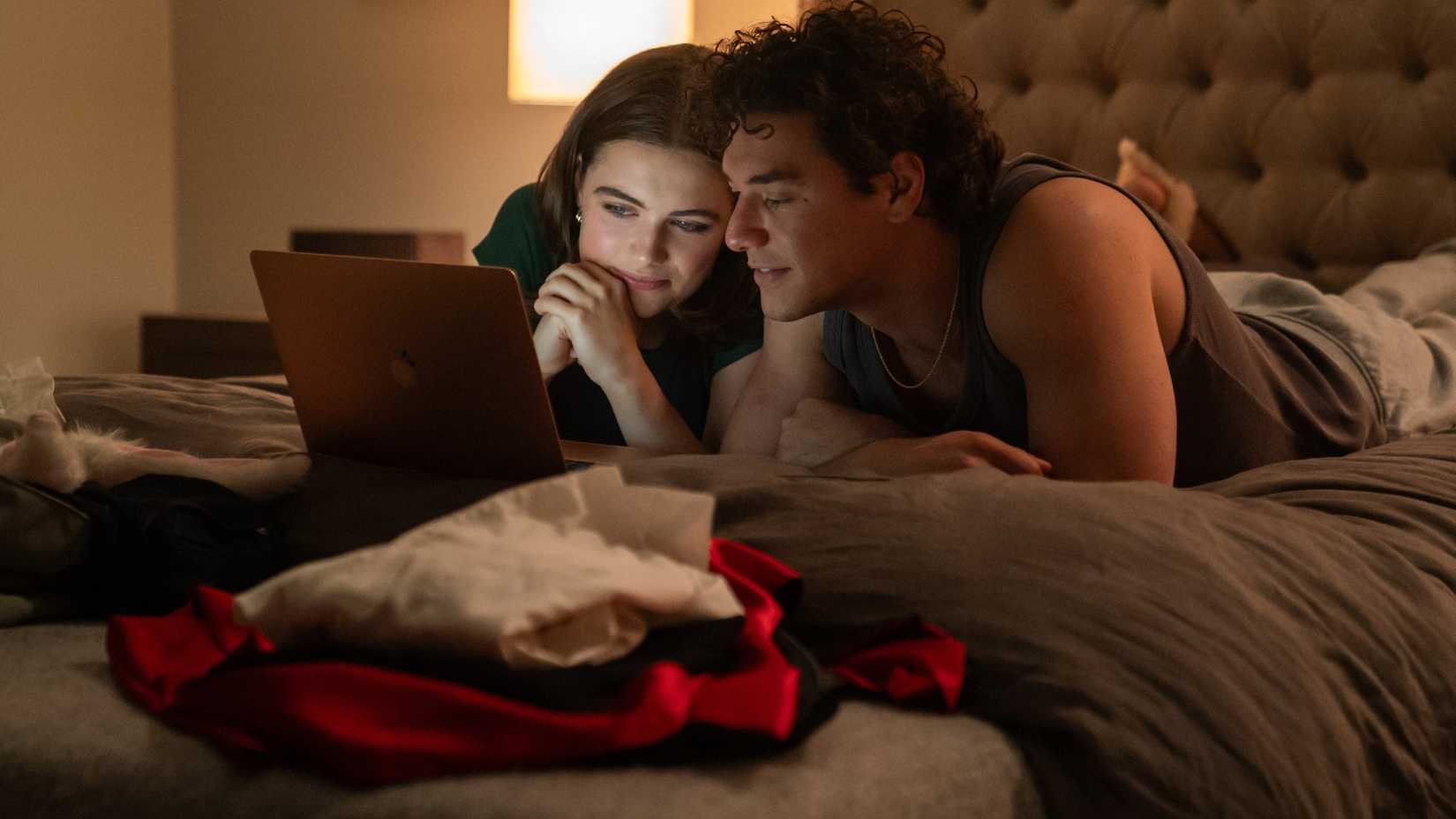 Hannah and Garrett watch a movie on their laptop in Off Campus