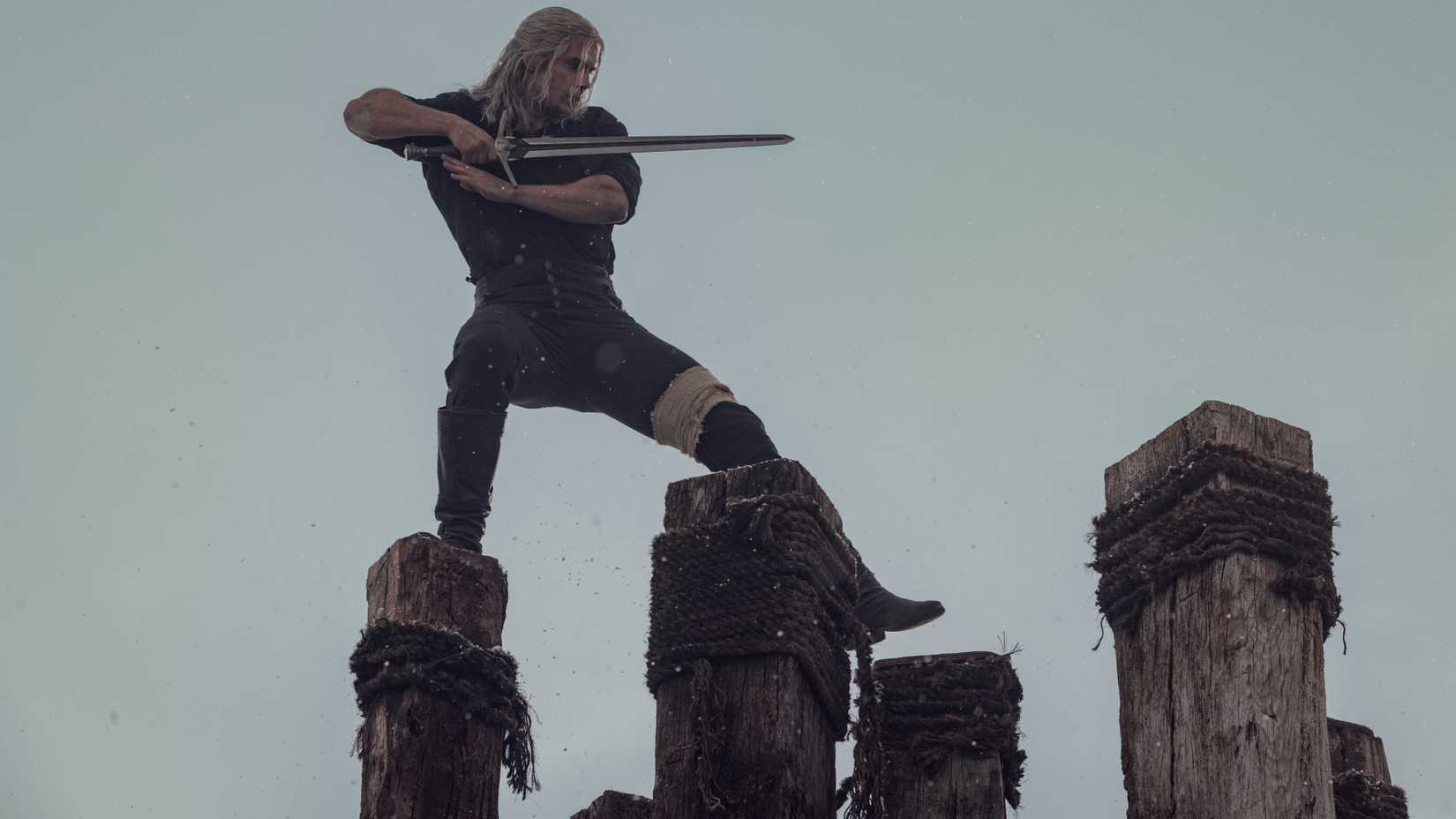 Henry Cavill as Geralt of Rivia wielding a sword in season 2 of The Witcher